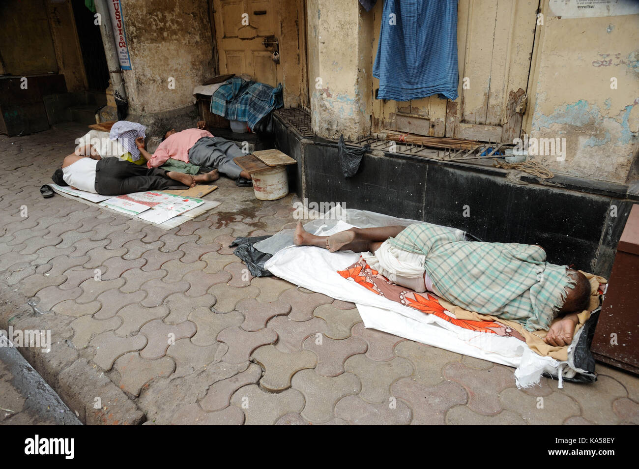Homeless man sleeping on footpath, mumbai, maharashtra, India, Asia Stock Photo