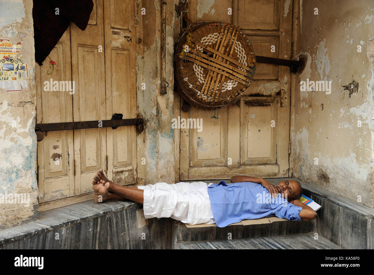 Homeless man sleeping in front of door, mumbai, maharashtra, India, Asia Stock Photo