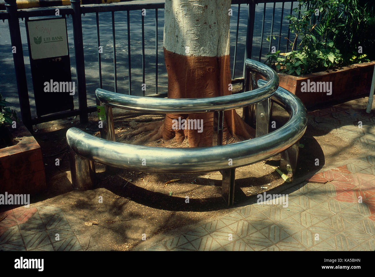 stainless steel tube sitting arrangement under tree, mumbai, maharashtra, India, Asia Stock Photo
