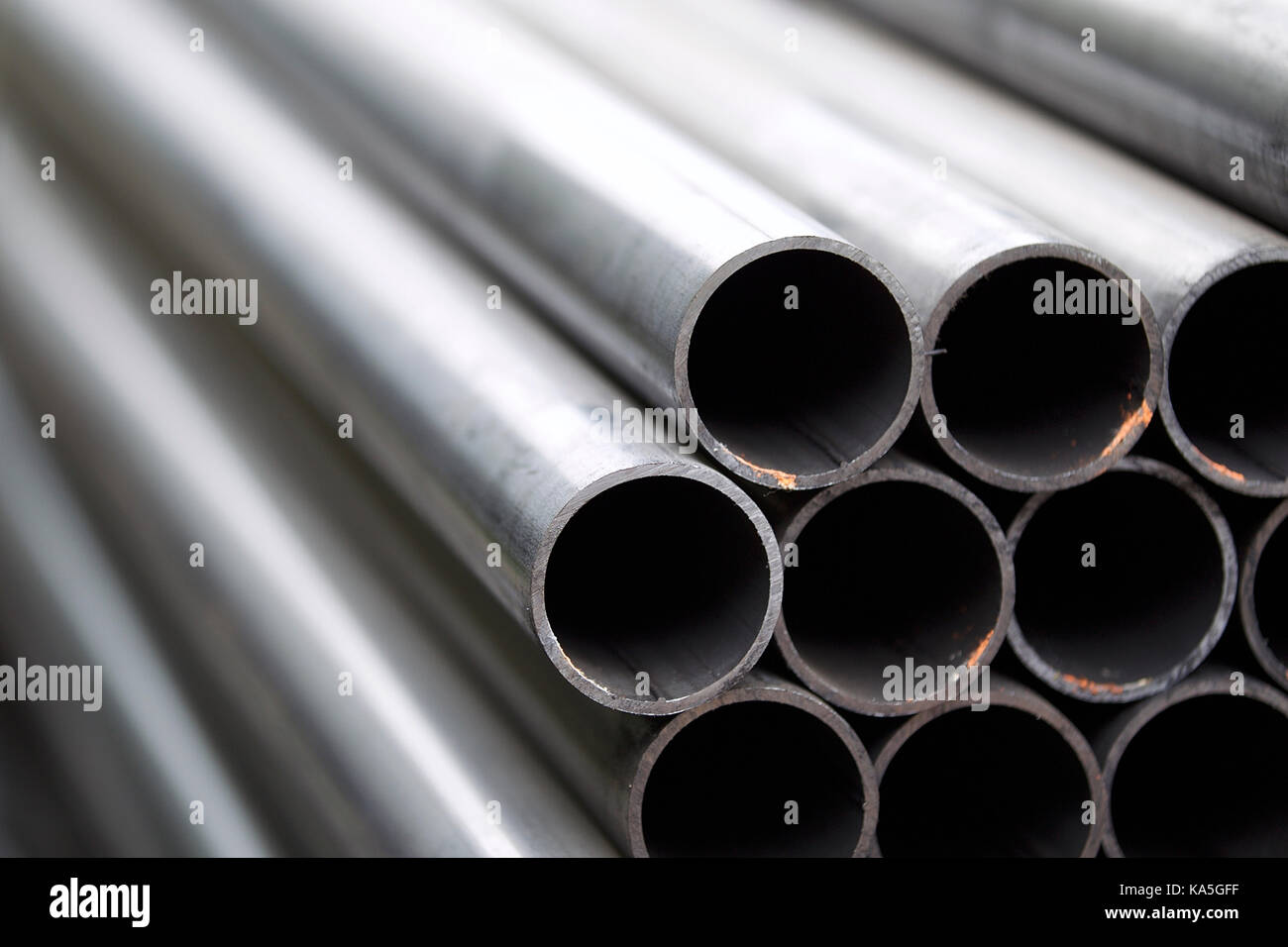 Metal profile pipe of round section in packs at the warehouse of metal ...