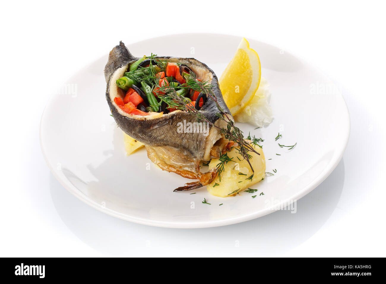 Delicious lunch. Stuffed fish with vegetables Stock Photo