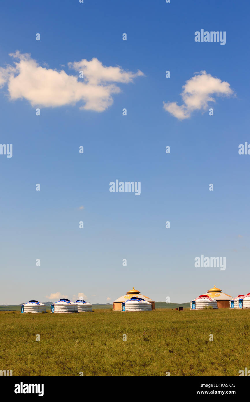 Mongolian traditional houses in immense grassland.They call these tents as ''Yurt'' Stock Photo