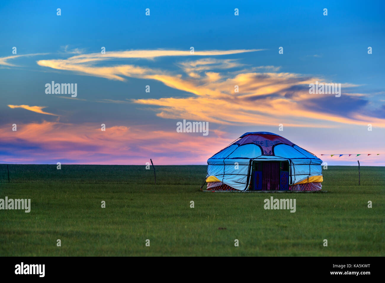 Mongolian traditional houses in immense grassland.They call these tents as ''Yurt'' Stock Photo