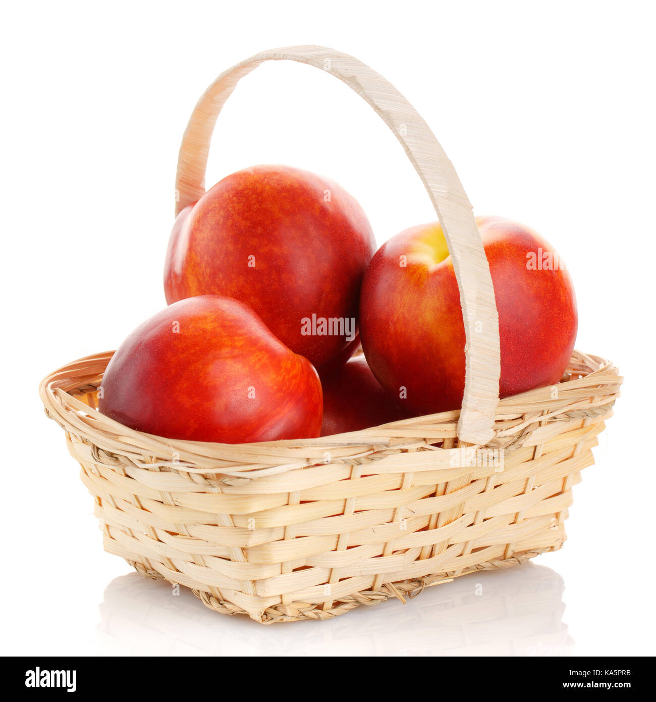 Fresh peach fruit in basket isolated Stock Photo Alamy