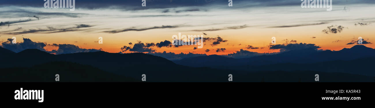 Sunset in the Carpathian Mountains. Silhouettes of the mountain range ...