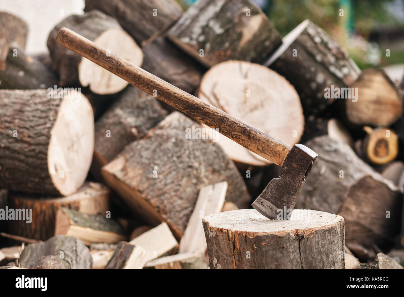 Axe stuck in a stump  Stock Photo