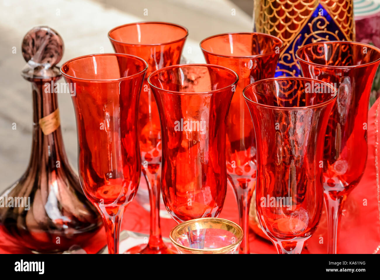 vintage red art drinking glasses on sale in bric-a-brac antiques street  market, shot at Mediterranean little town of Chiavari, Genova, Liguria,  Italy Stock Photo - Alamy, image size:1300x957