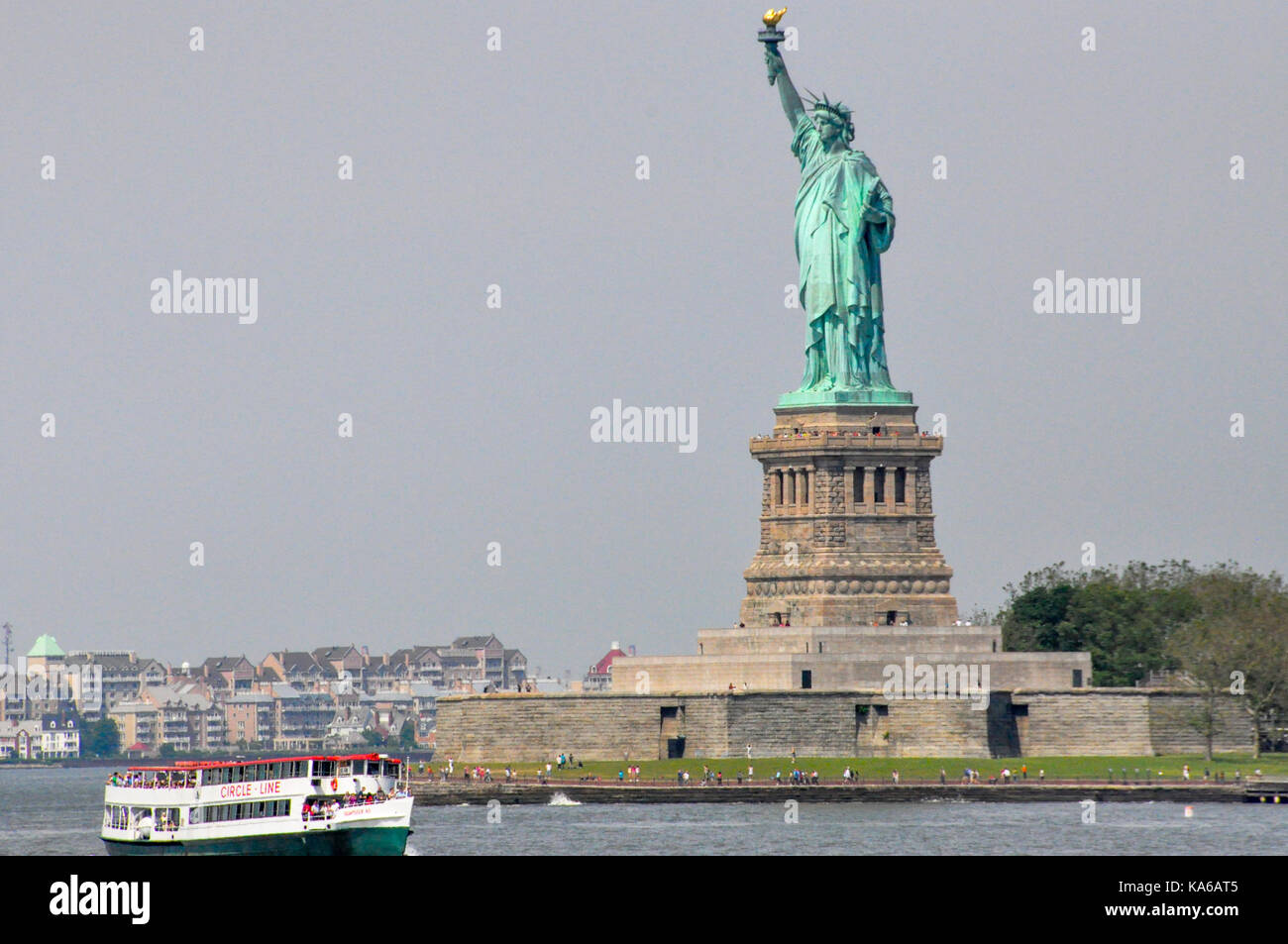 Circle Line tourist ferry passing the Statue of Liberty, New York City, USA. Stock Photo