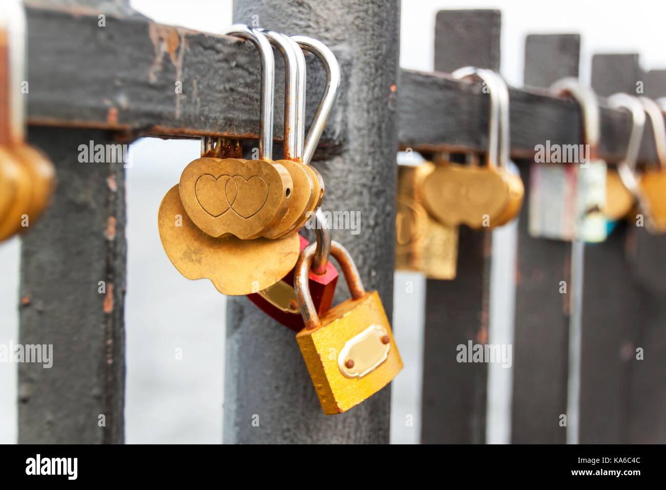 Lock as a symbol of eternal love. Metal locks on the railing of the ...