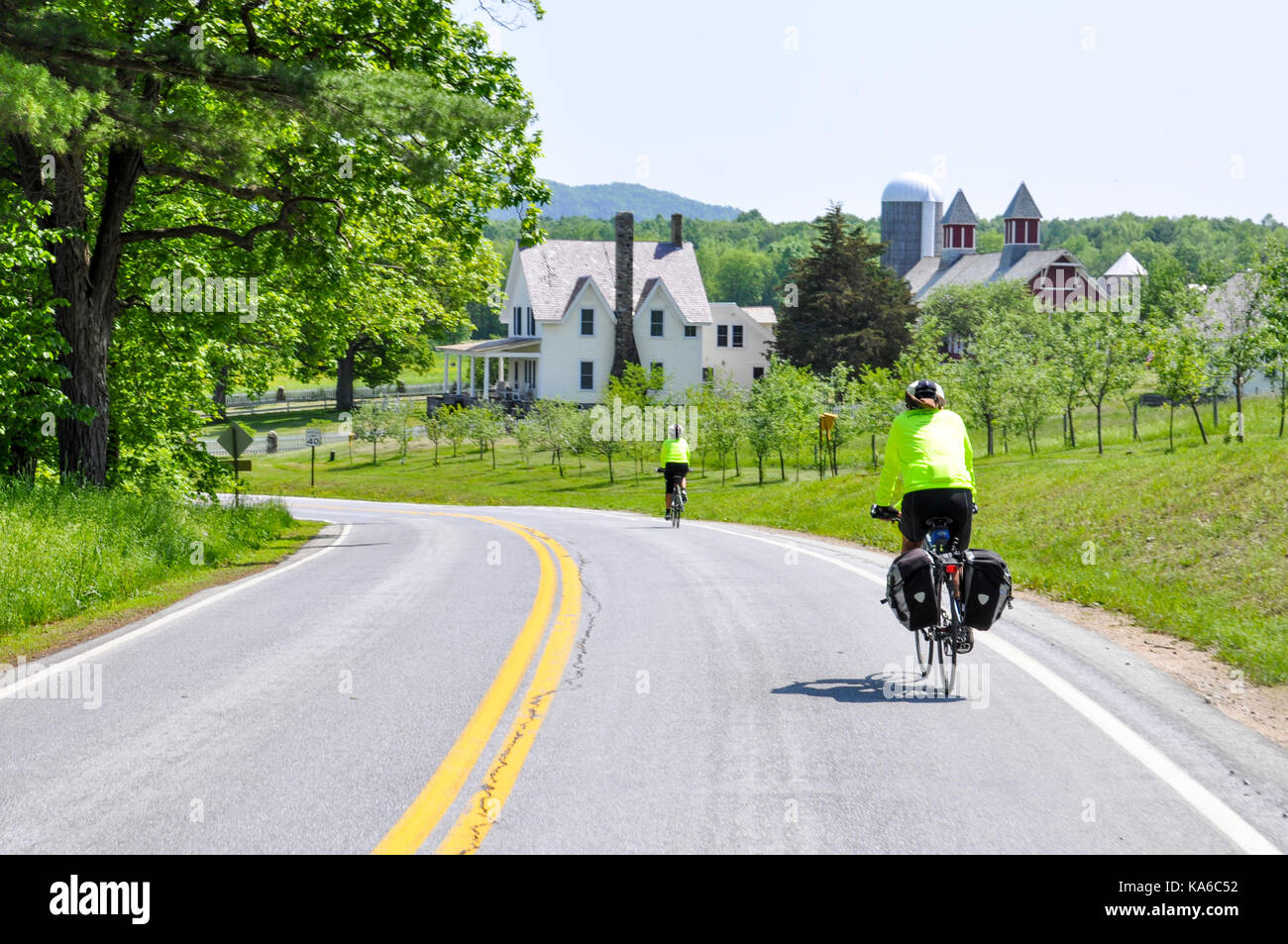 Two touring cyclists cycling on the Hudson Route 9 cycleway in upstate New York, USA. Stock Photo