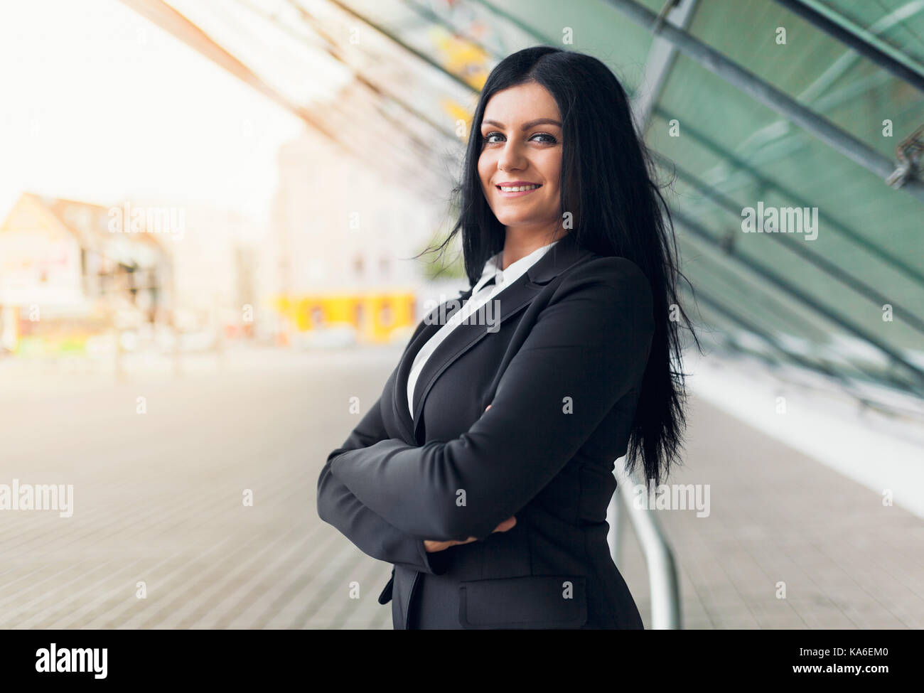 Beautiful young and confidents business woman in urban setting Stock Photo