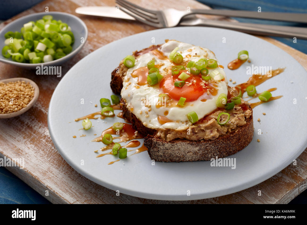 Honey sriracha fried egg on toast Stock Photo Alamy