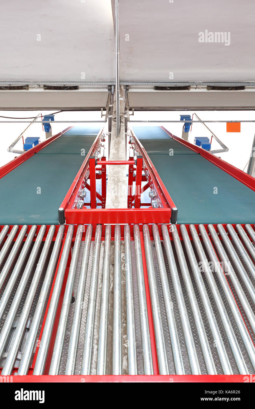 Two Conveyor Belts at Ramp in Distribution Warehouse Stock Photo