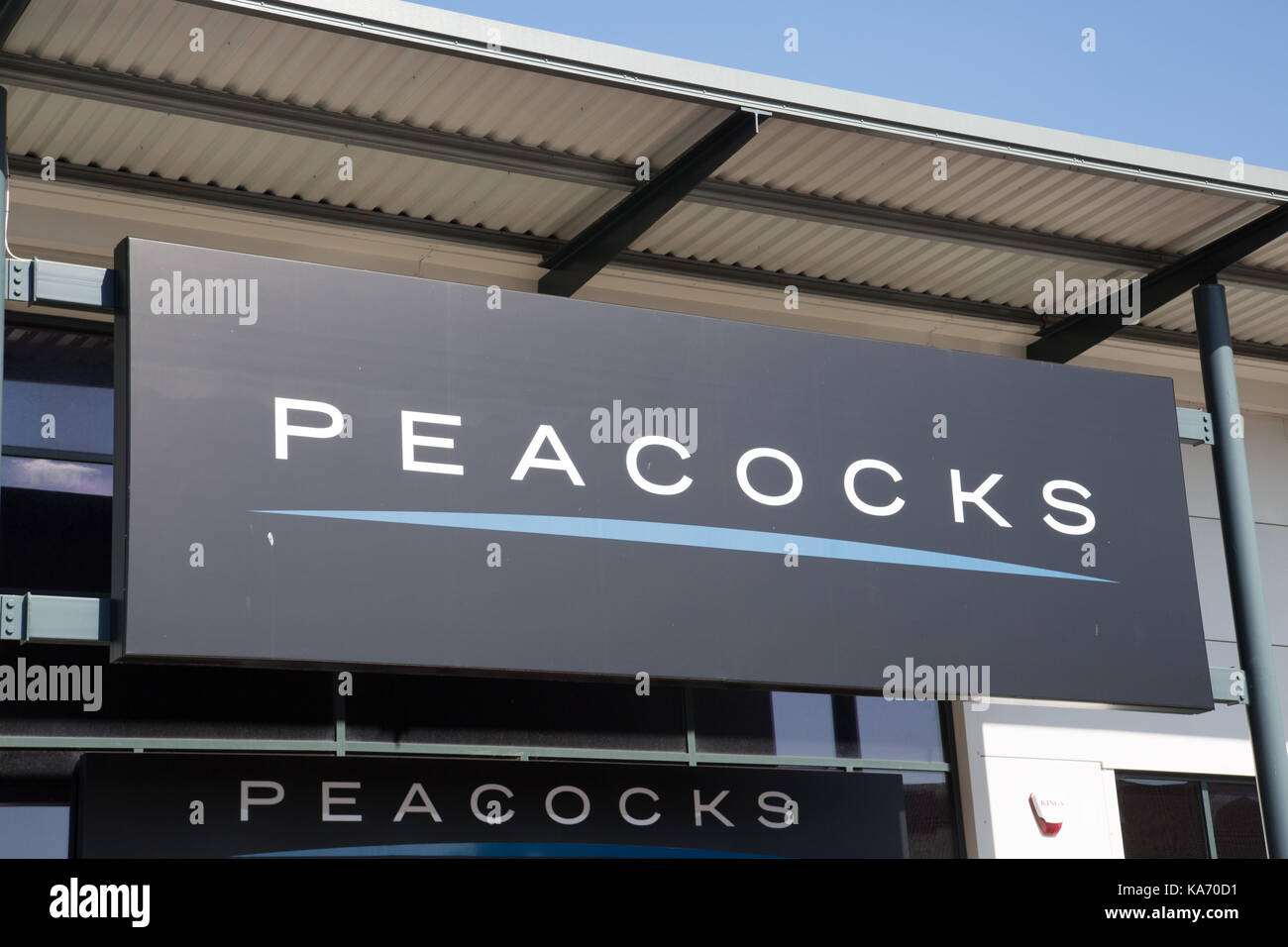 Peacocks store signage Stock Photo