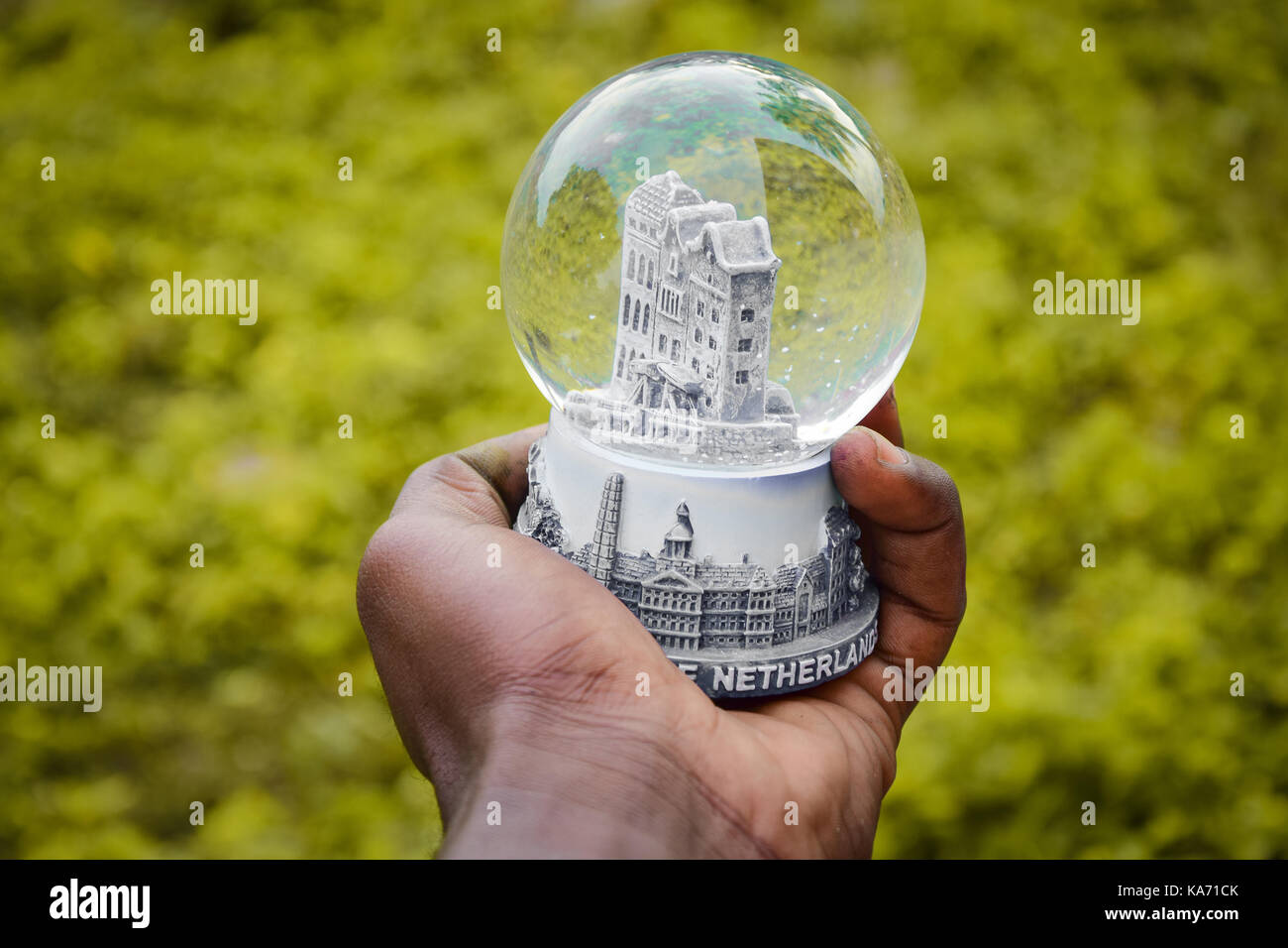 Hand holding Glass Orb Stock Photo