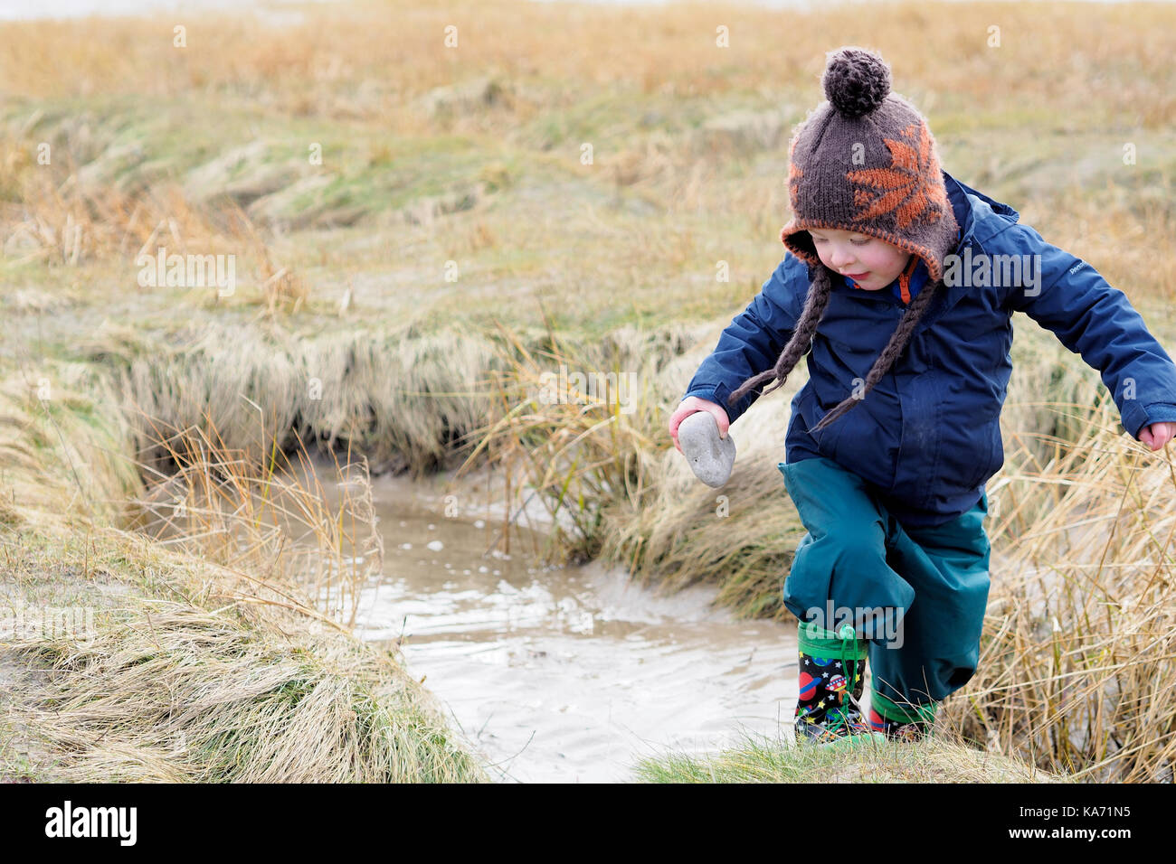 Collecting stones to throw Stock Photo Alamy
