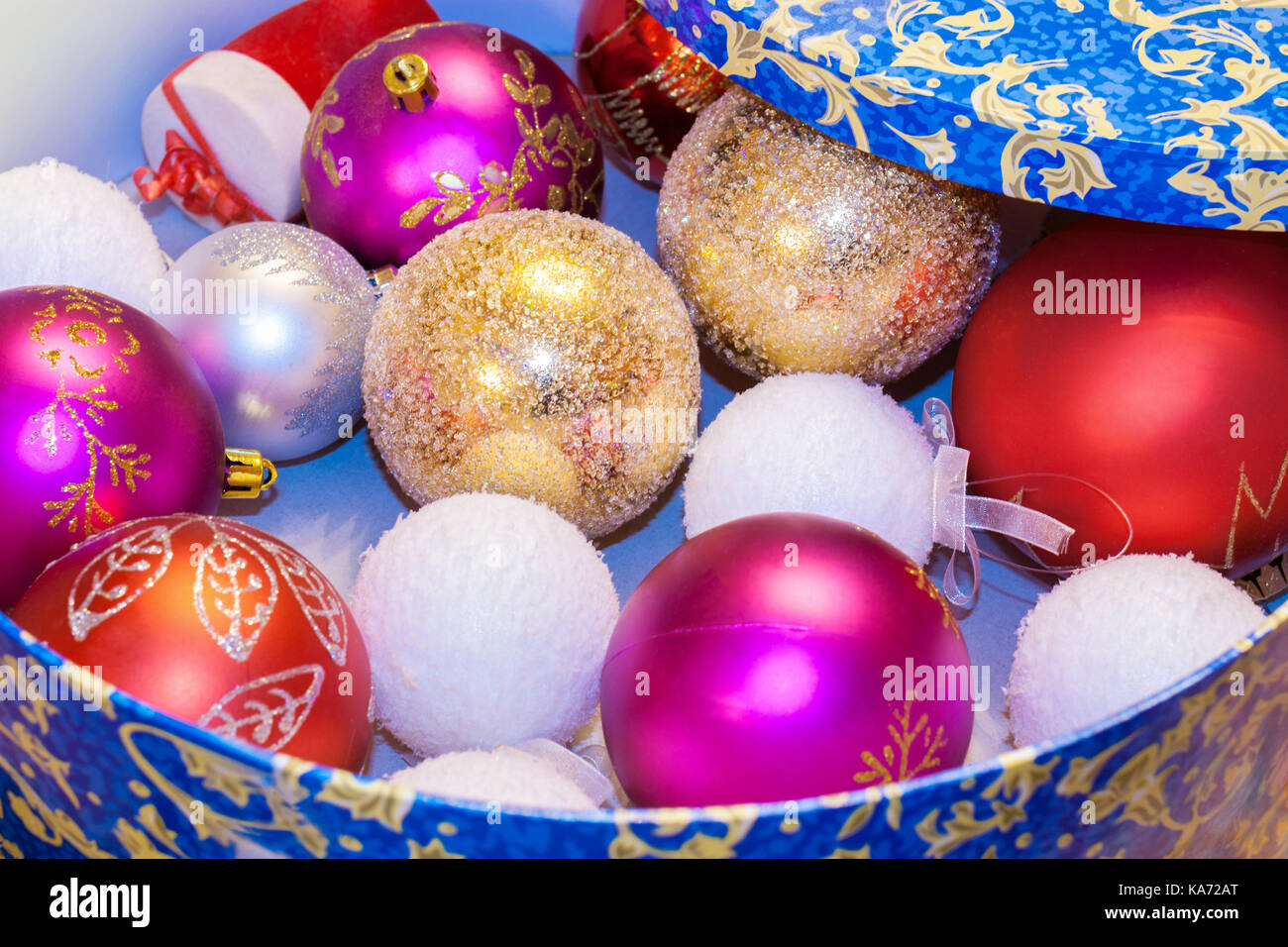 christmas toys red pink factured white textured golden balls are factured