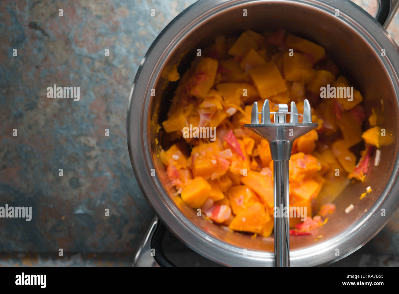 Casserole with ingredients for pumpkin soup and blender horizontal Stock Photo
