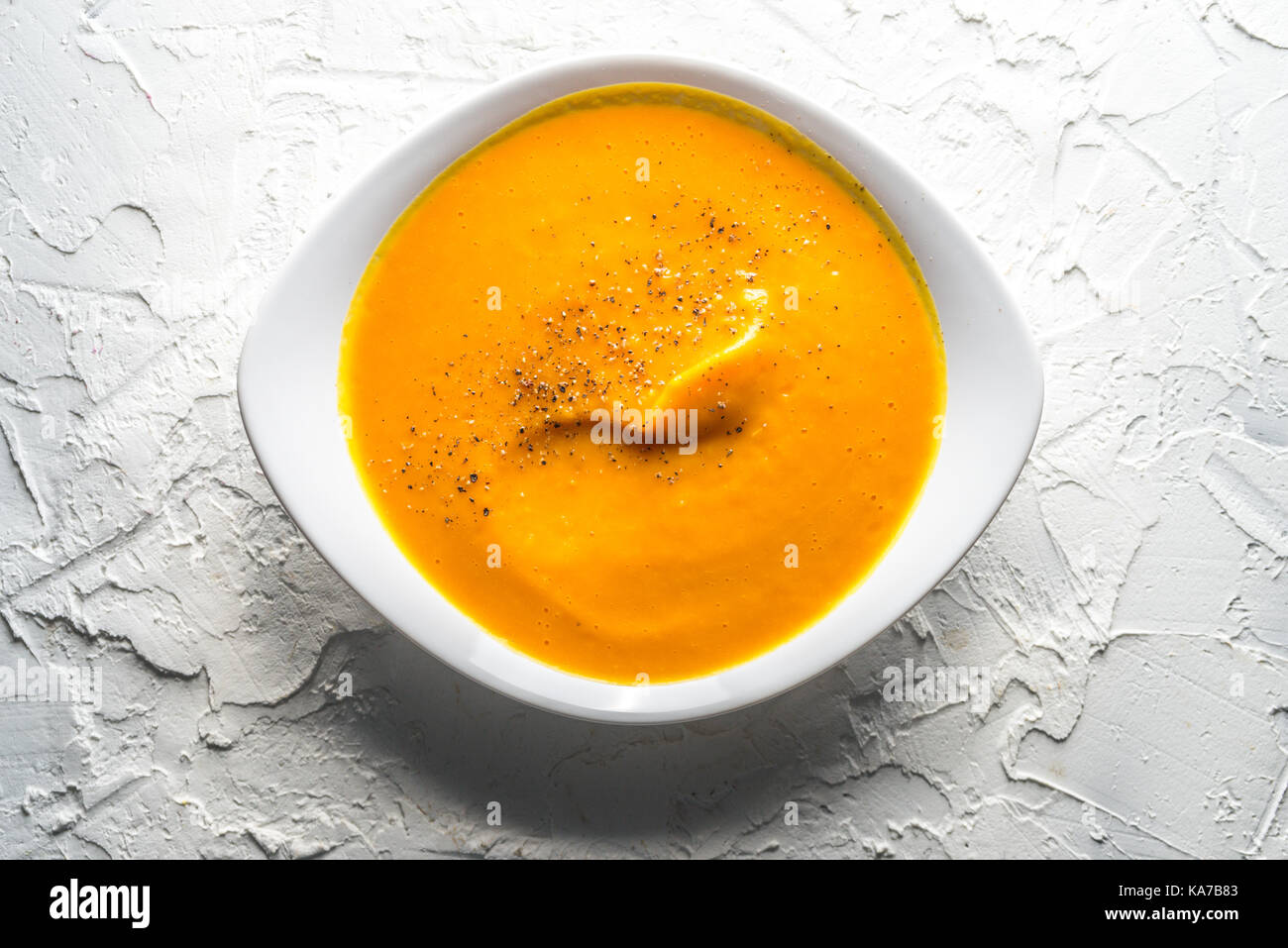 Homemade pumpkin soup in a white horizontal Stock Photo