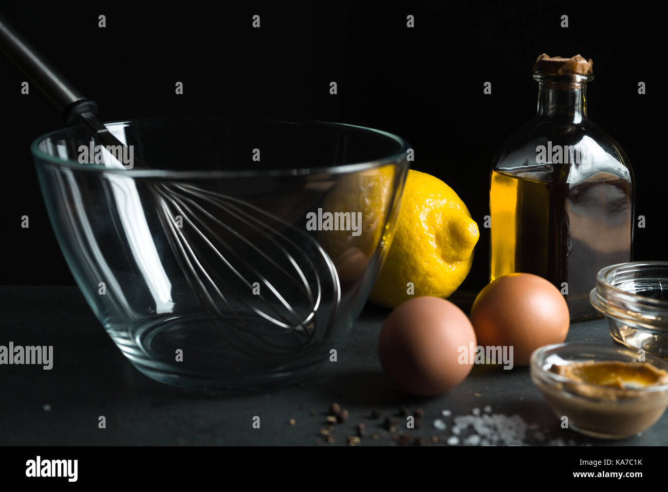 Eggs, olive oil, mustard on a black background horizontal Stock Photo