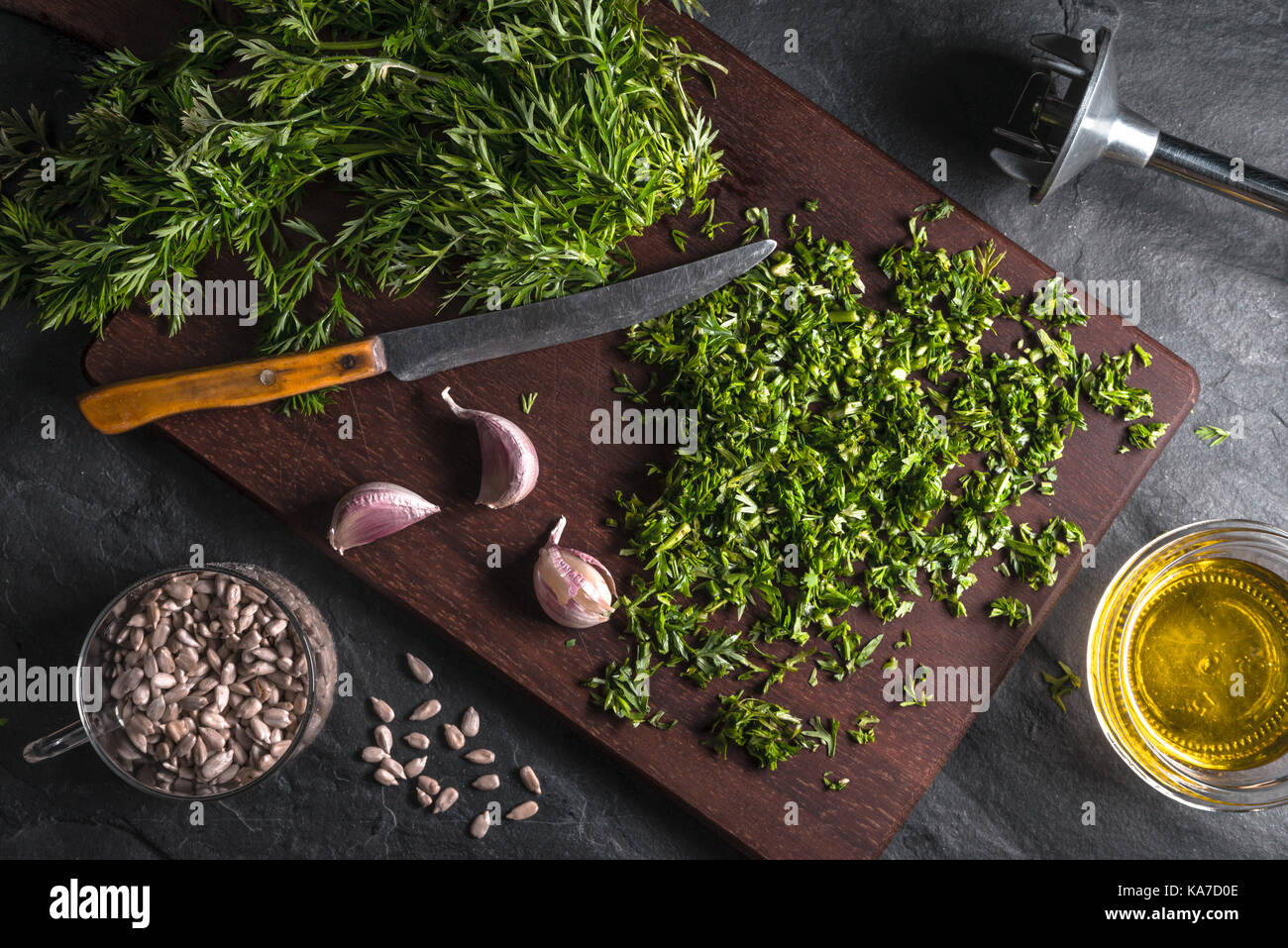 Preparation of pesto from carrot leaves, garlic, sunflower seeds horizontal Stock Photo