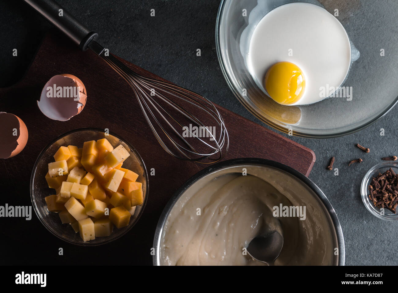 Base sauce, cheese, egg with cream, whisk for mornay sauce horizontal Stock Photo
