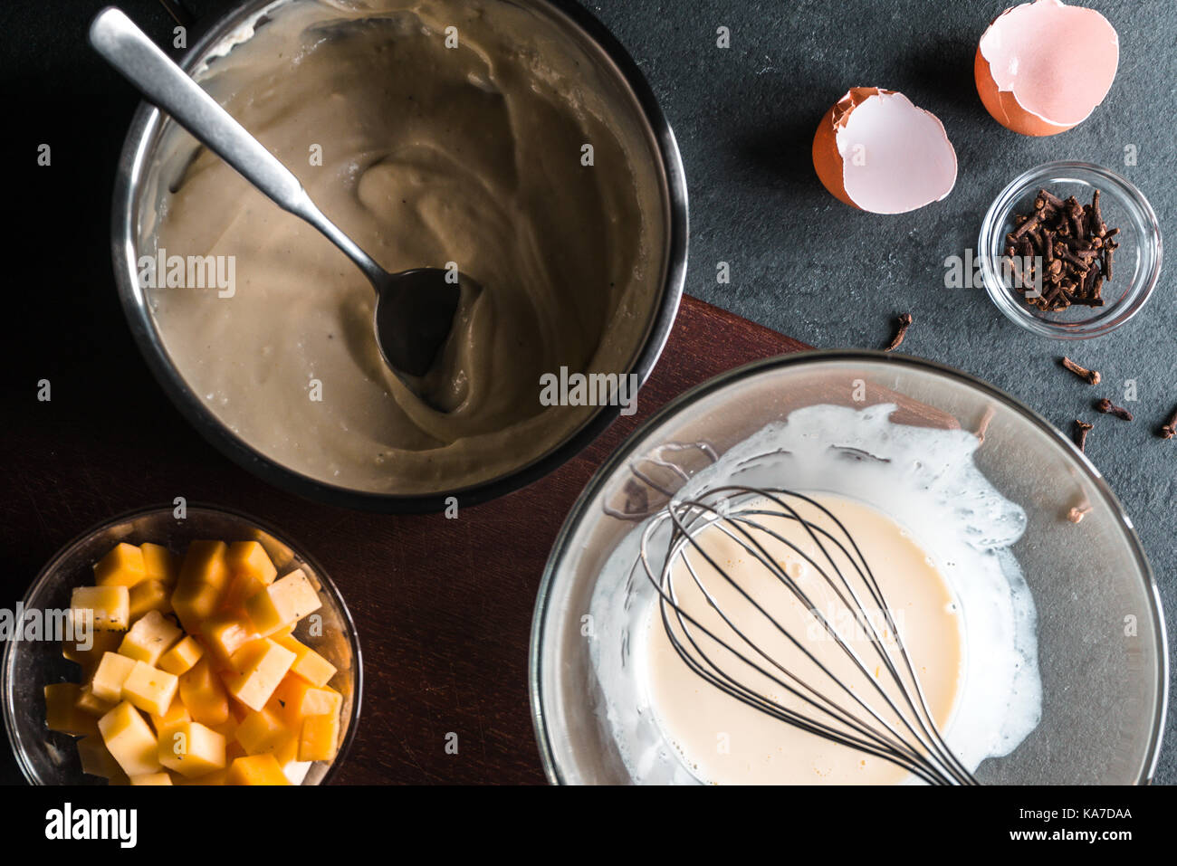 Whipped egg with milk, base sauce and cheese on a gray stone horizontal Stock Photo