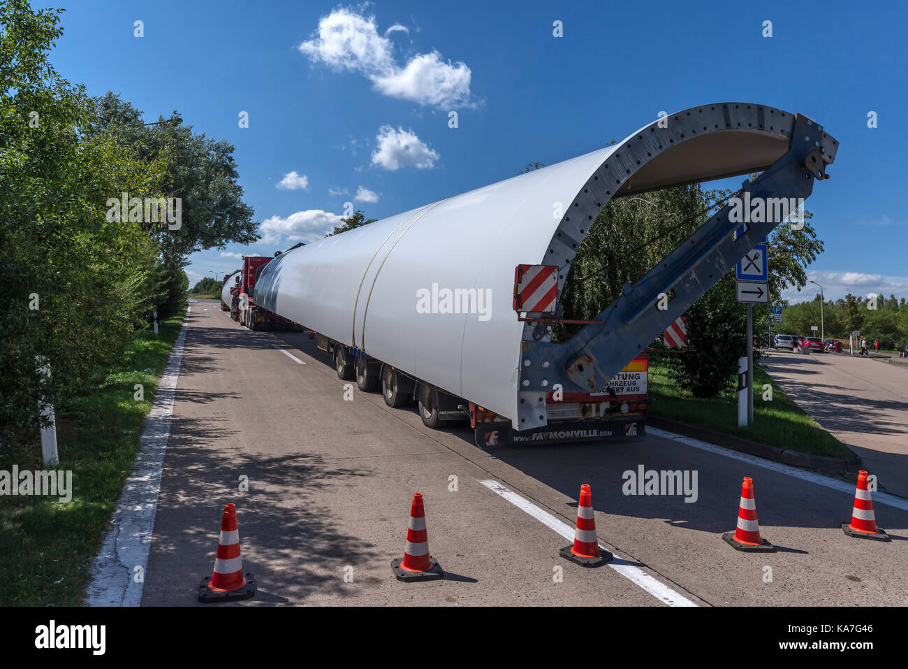 Heavy-duty lorry with windmill sections on a motorway rest area on the A 24, Mecklenburg-Western Pomerania, Germany Stock Photo