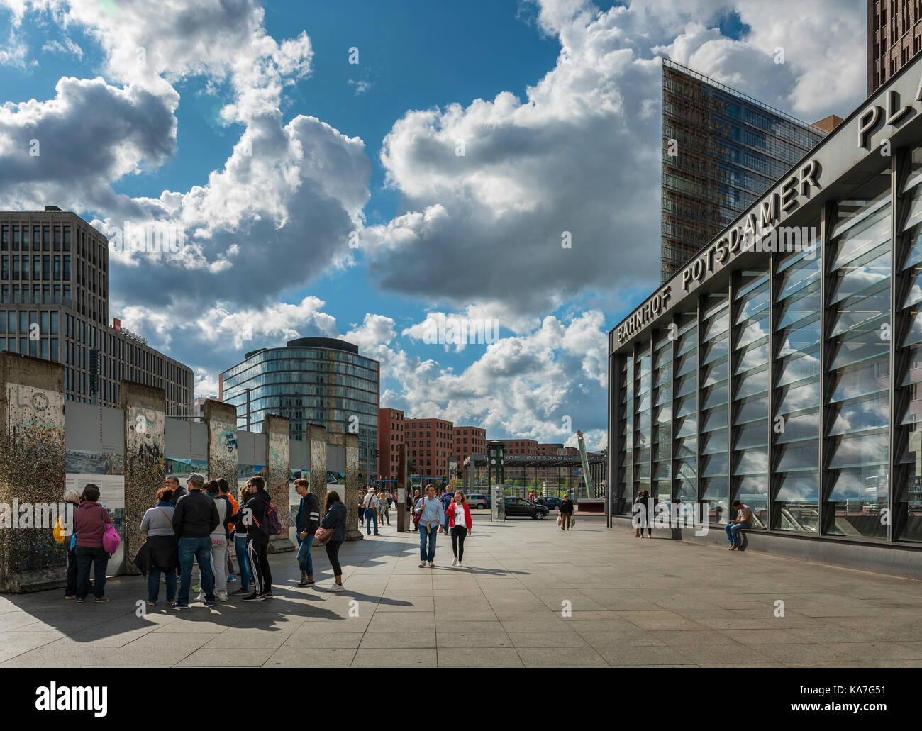 Tourists and passers-by at Potsdamer Platz railway station, remains of the Berlin Wall, Berlin, Germany Stock Photo