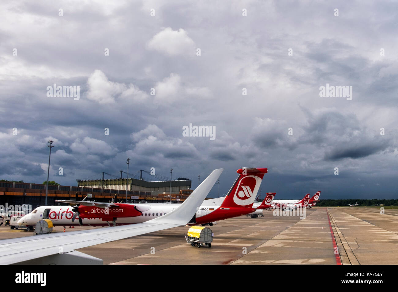 Berlin,Tegel Airport. Air Berlin planes on the ground. Airline facing uncertain future after financial problems, Stormy future, Black clouds overhead Stock Photo