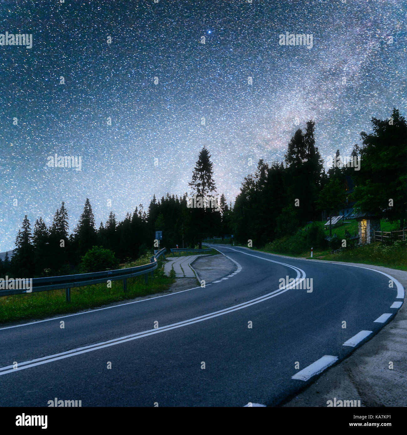 Asphalt road under a starry night sky and the Milky Way Stock Photo - Alamy