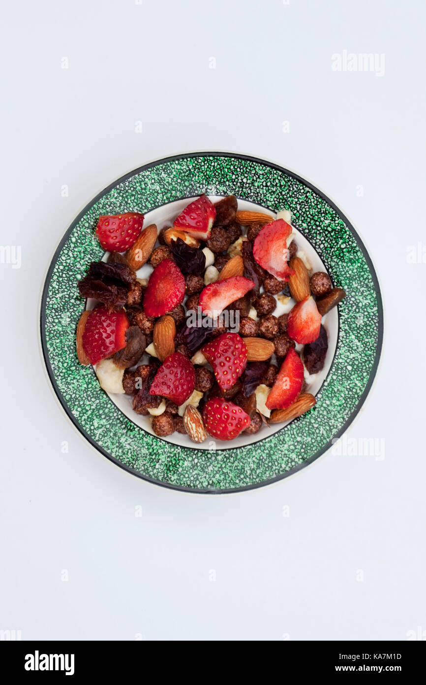 Corn flakes almonds and fruits on a bowl Stock Photo Alamy
