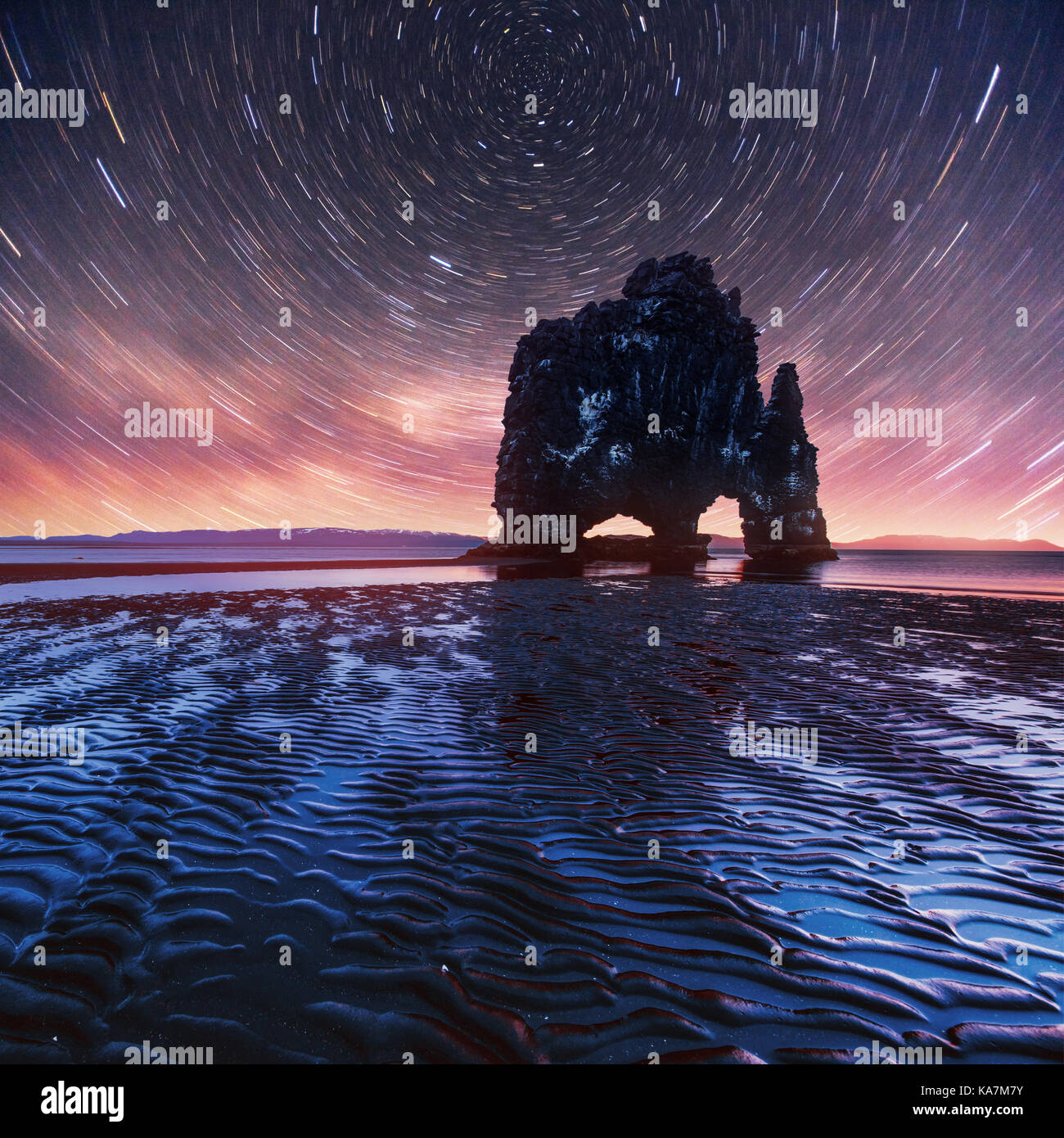 Starry Rocks starry sky in a spectacular rock in the sea on the Northern coast of ...