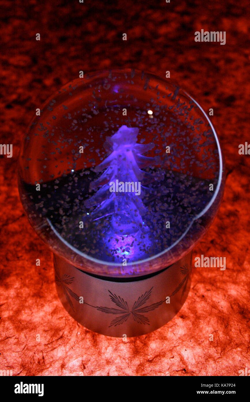 Fluorescent Christmas tree inside snow globe Stock Photo Alamy