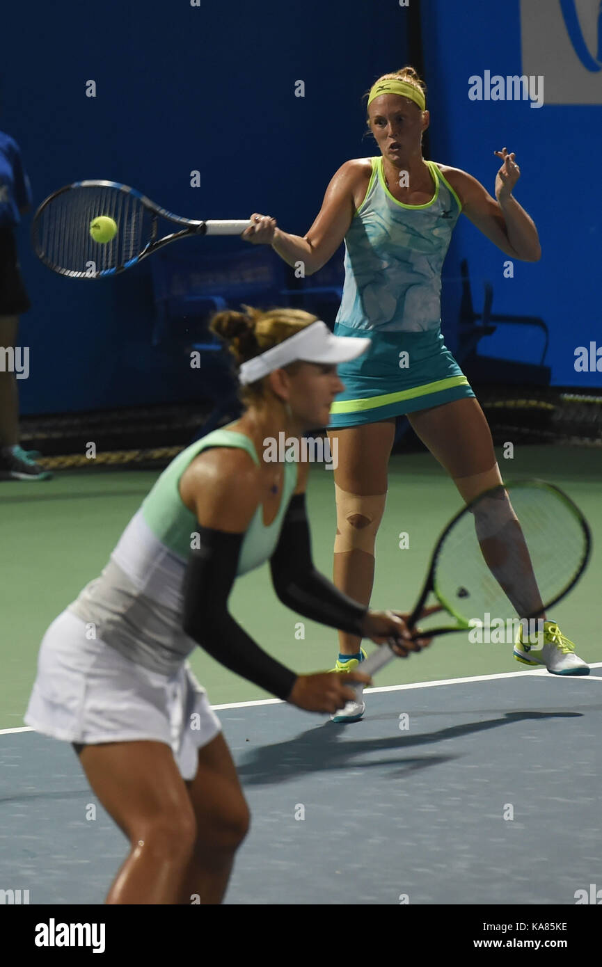 Wuhan, China. 25th September, 2017. Nicole Melichar (L) of the United States and Anna Smith of Britain compete during the doubles first round match against Daria Gavrilova of Australia and Barbora Strycova of Czezh Republic at 2017 WTA Wuhan Open in Wuhan, capital of central China's Hubei Province, on Sept. 25, 2017. Nicole Melichar and Anna Smith won 2-0. Credit: Xinhua/Alamy Live News Stock Photo