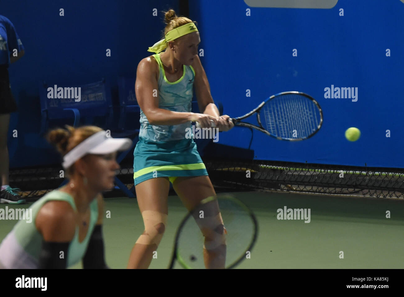 Wuhan, China. 25th September, 2017. Nicole Melichar (L) of the United States and Anna Smith of Britain compete during the doubles first round match against Daria Gavrilova of Australia and Barbora Strycova of Czezh Republic at 2017 WTA Wuhan Open in Wuhan, capital of central China's Hubei Province, on Sept. 25, 2017. Nicole Melichar and Anna Smith won 2-0. Credit: Xinhua/Alamy Live News Stock Photo