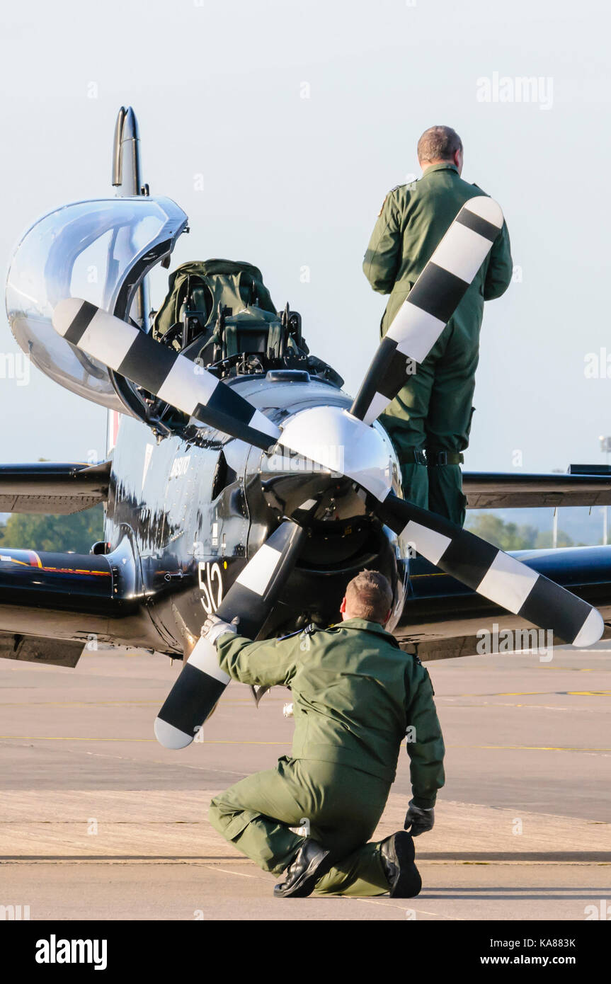 RAF Aldergrove, Northern Ireland. 25/09/2017 - Pilot checks his Tucano training aircraft after he lands at RAF Aldergrove as part of their centenary celebrations.  One of the aircraft was painted in a specially designed commemorative livery from the Battle of Britain Spitfire. Stock Photo