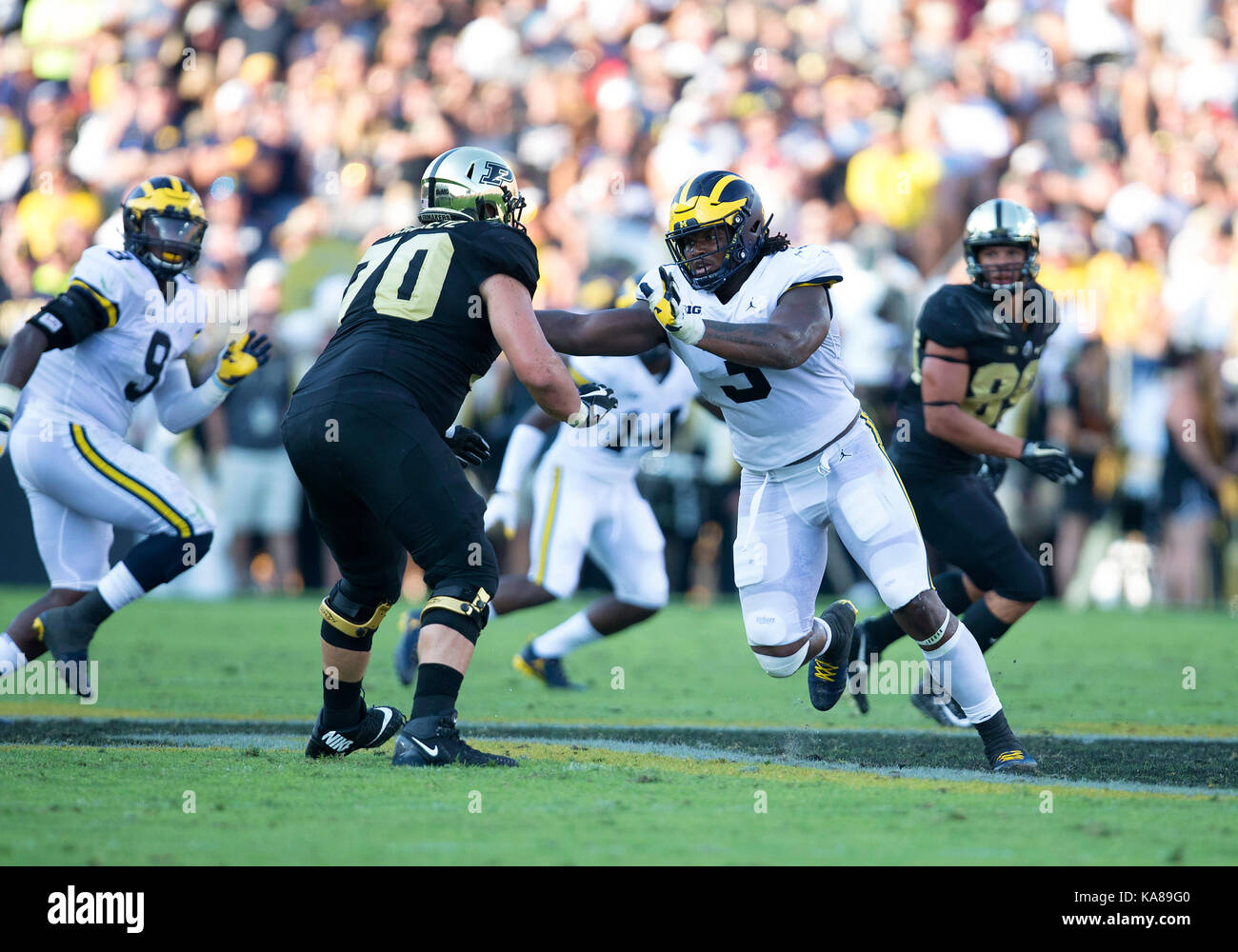 West Lafayette, Indiana, USA. 23rd Sep, 2017. Michigan defensive lineman Rashan Gary (3) and Purdue offensive lineman David Steinmetz (70) battle at the line of scrimmage during NCAA football game action between the Michigan Wolverines and the Purdue Boilermakers at Ross-Ade Stadium in West Lafayette, Indiana. Michigan defeated Purdue 28-10. John Mersits/CSM/Alamy Live News Stock Photo
