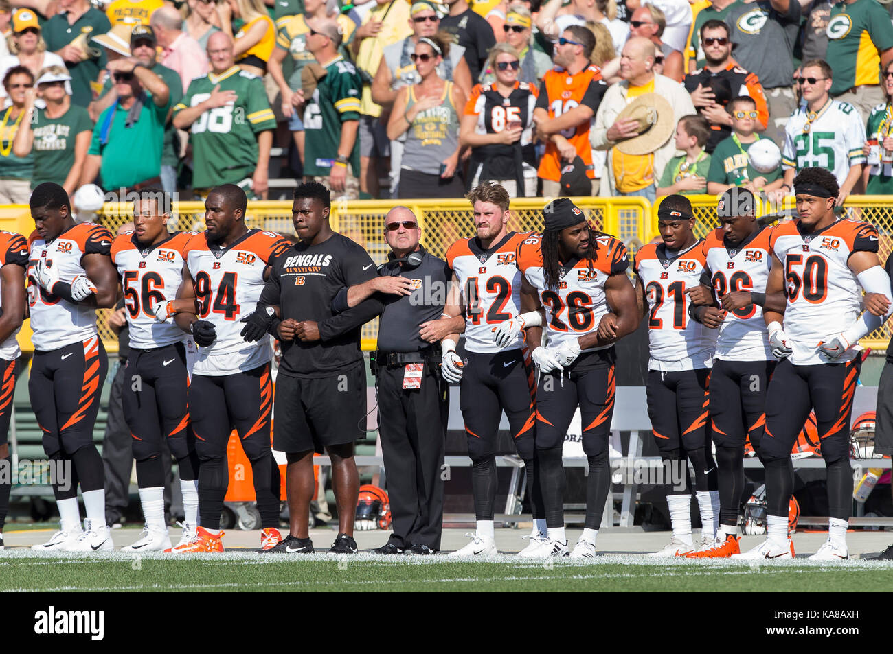 Green Bay, USA. 24th Sep, 2017. Cincinnati players lock arms during the national anthem before the NFL Football game between the Cincinnati Bengals and the Green Bay Packers at Lambeau Field in Green Bay, WI. Green Bay defeated Cincinnati in overtime 27-24. John Fisher/CSM Stock Photo