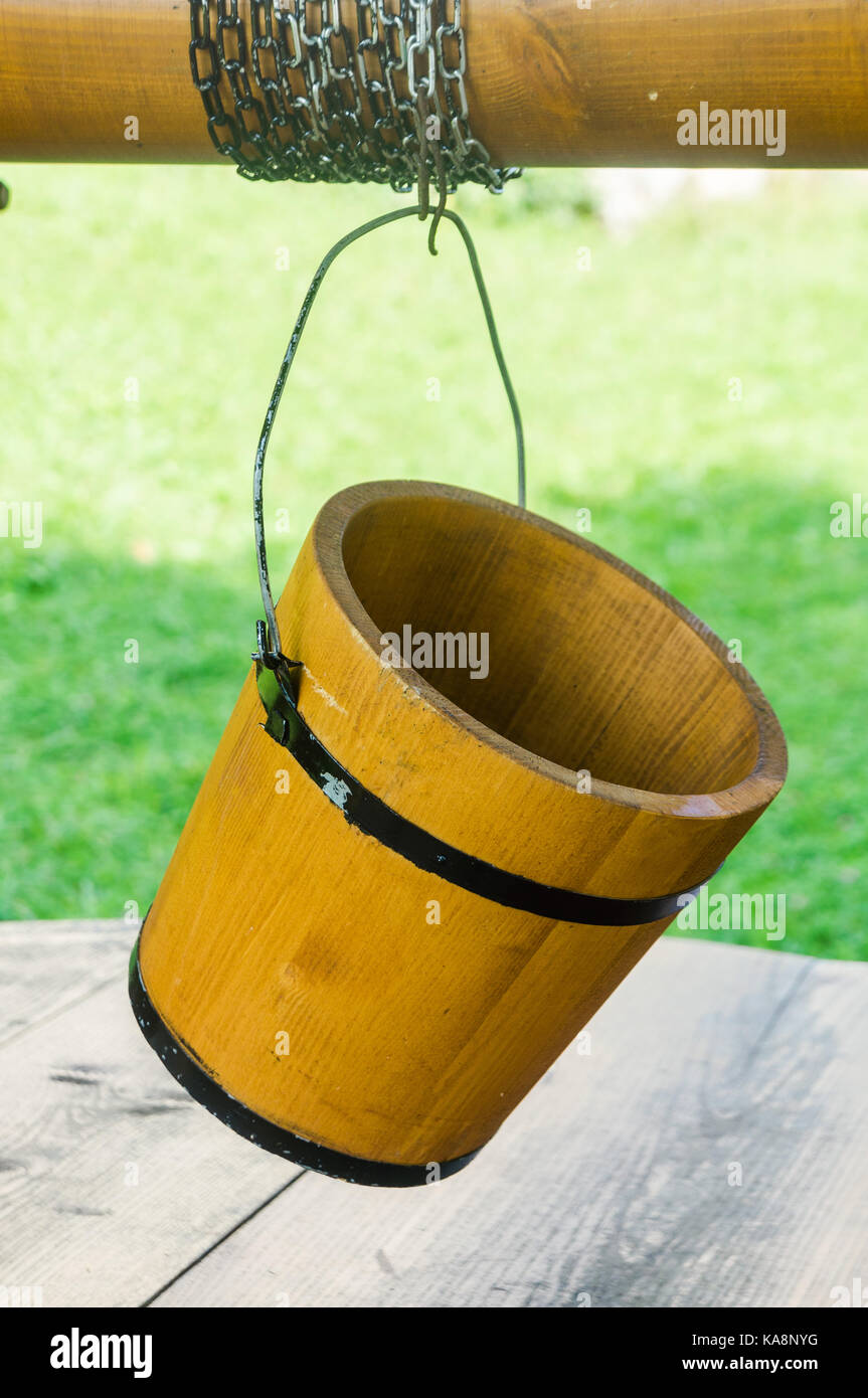 Old style wooden bucket on old well Stock Photo Alamy
