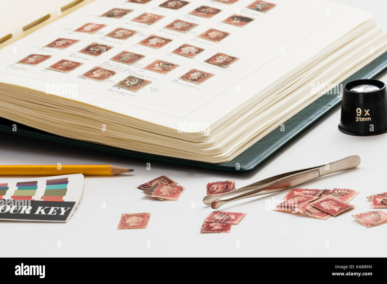 https://c8.alamy.com/comp/KA8R6N/england-victoria-penny-red-stamps-with-annotations-in-stamp-album-KA8R6N.jpg