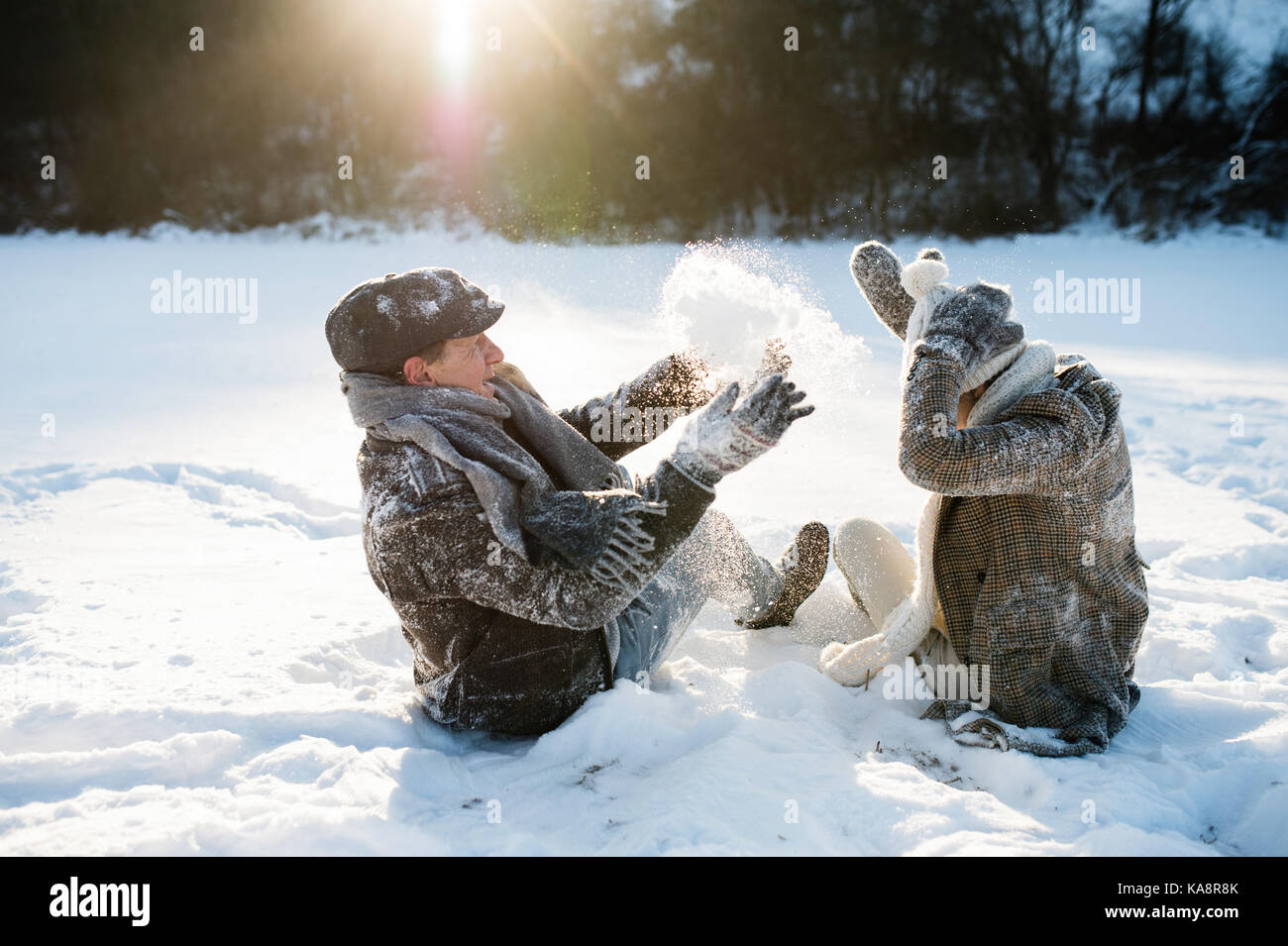 Beautiful senior couple in sunny winter nature. Stock Photo