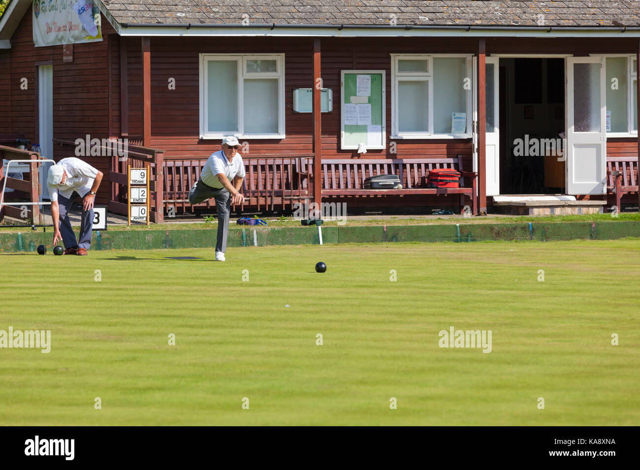 Bowls player seniors in whites at the Rye bowls club, East Sussex UK Stock Photo