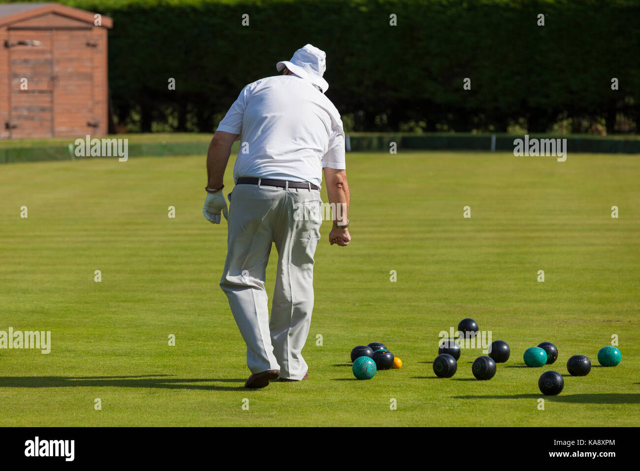 Bowls player seniors in whites at the Rye bowls club, East Sussex UK Stock Photo