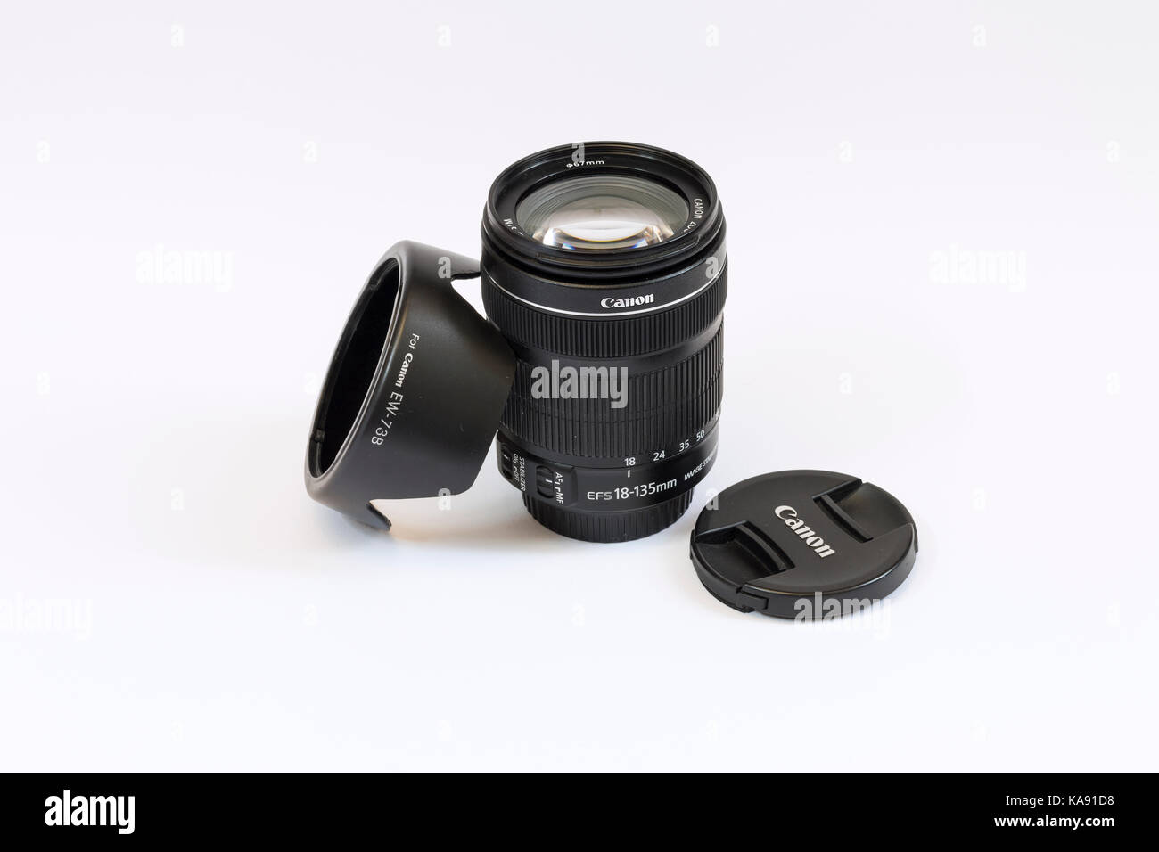 Canon EF-S 18-135mm F3.5-5.6 STM IS lens with cap and hood Stock Photo
