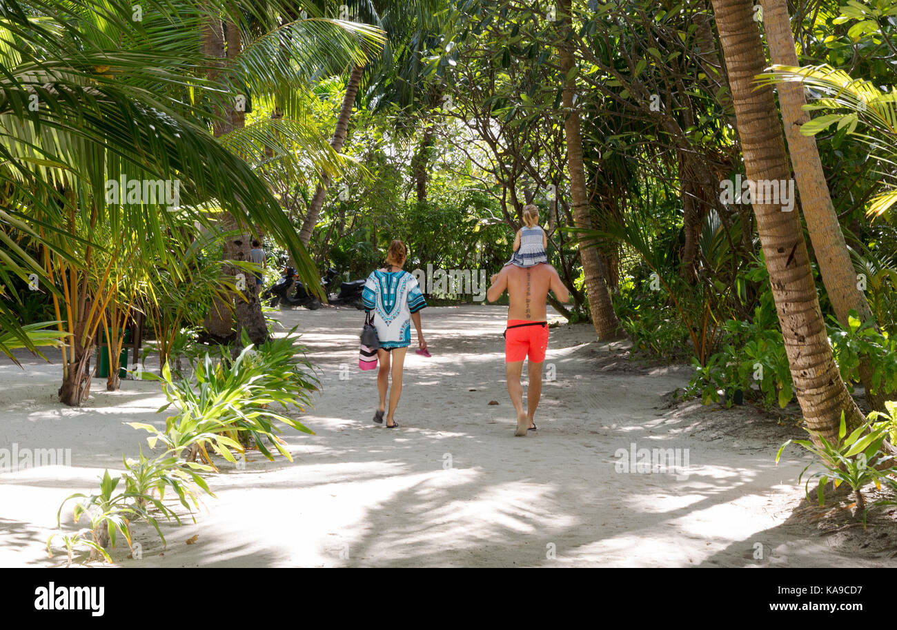 A family on holiday, Kuramathi resort,  the Maldives, Asia Stock Photo