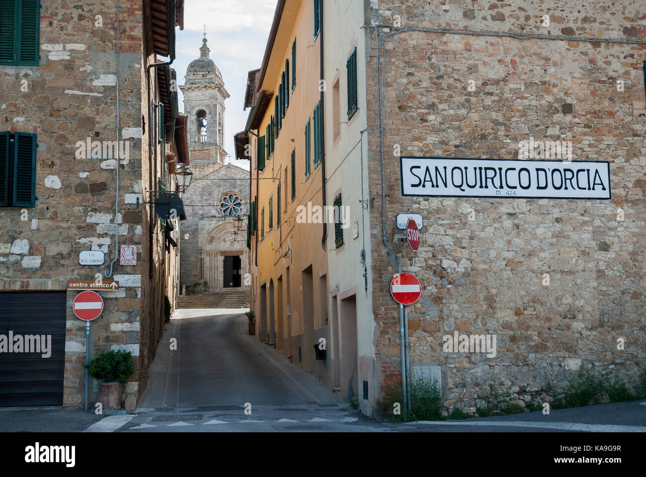 TUSCANY-JUNE 2: the border of the village of San Quirico d'Orcia and the Collegiate church in the distance,Orcia valley,Tuscany,Italy,on June 2,2017. Stock Photo