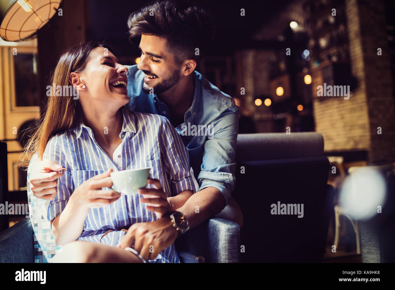 Young attractive couple on date in coffee shop Stock Photo Alamy