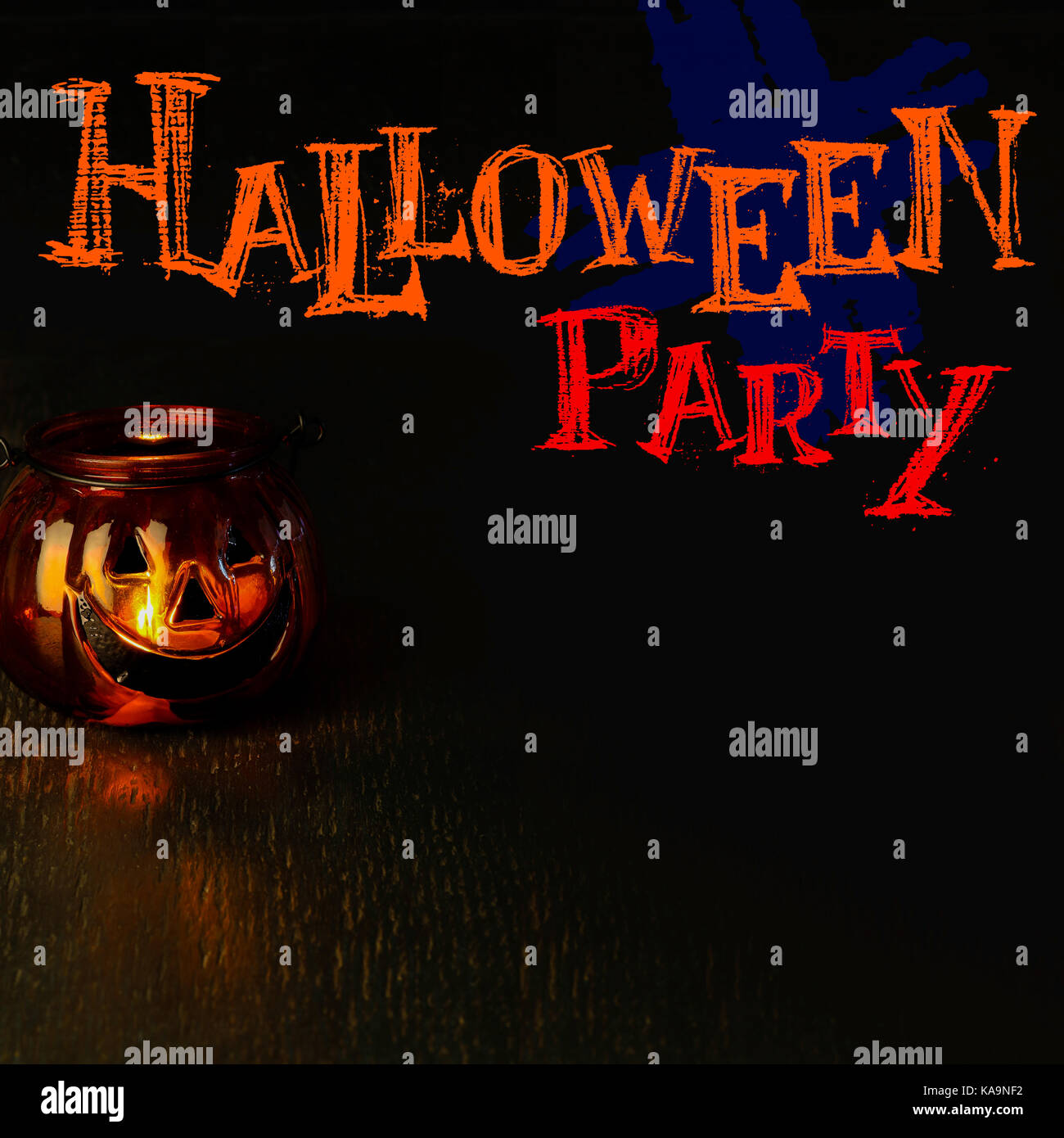 Halloween party invitation concept, pumpkin head bowl lantern on dark background with copy space Stock Photo