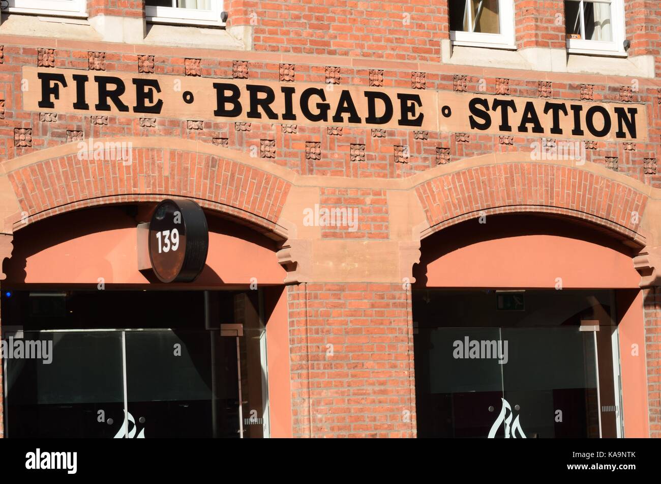 Front of red brick fire station Stock Photo - Alamy